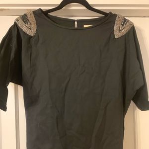 Black fitted cocktail dress with shoulder details